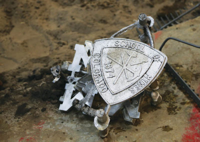 Mines logo cast in metal